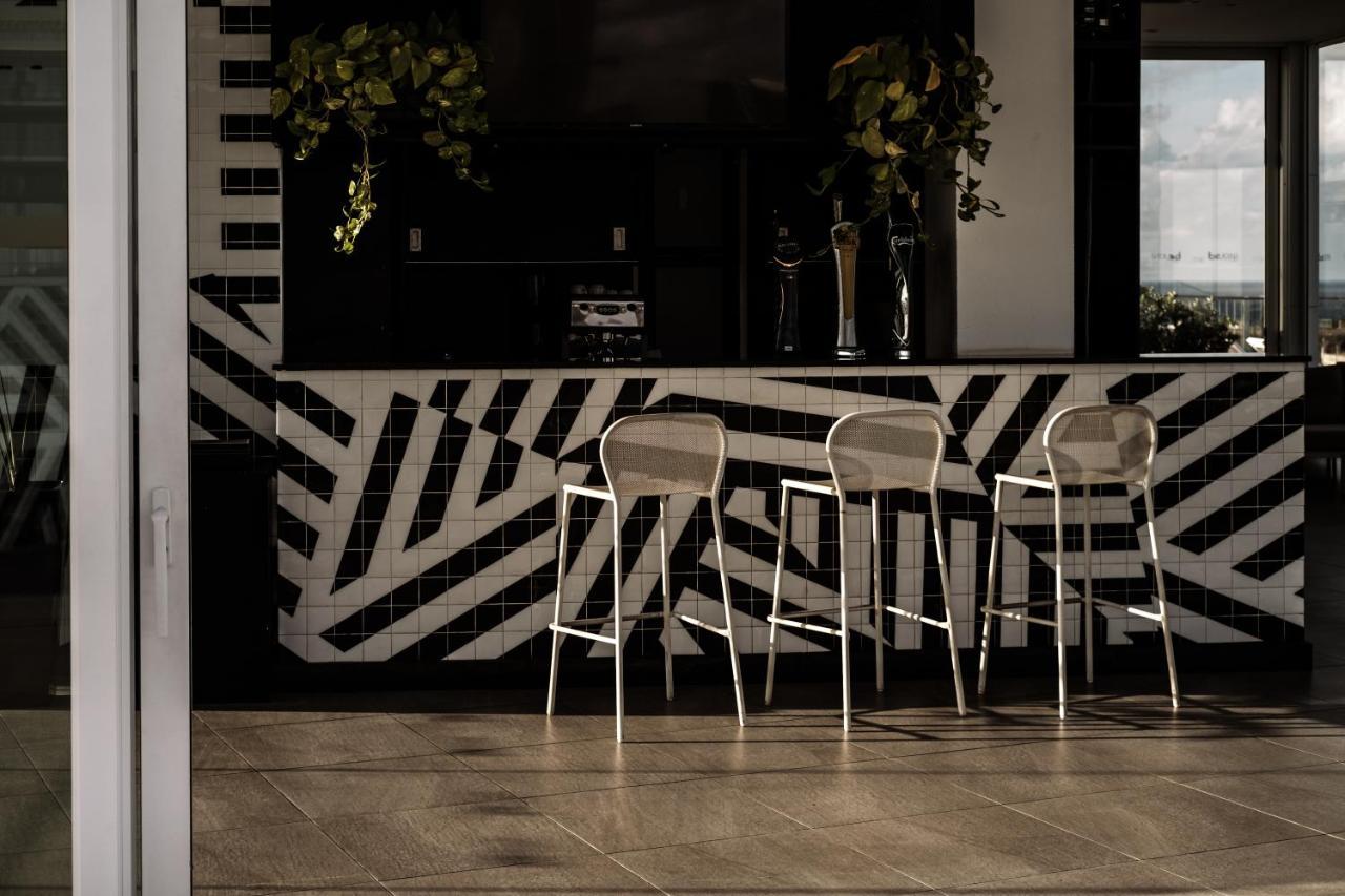 Be.Hotel Saint Julian's Exterior photo "The interior of the house is a combination of black and white tiles, and the furniture is also black and white."